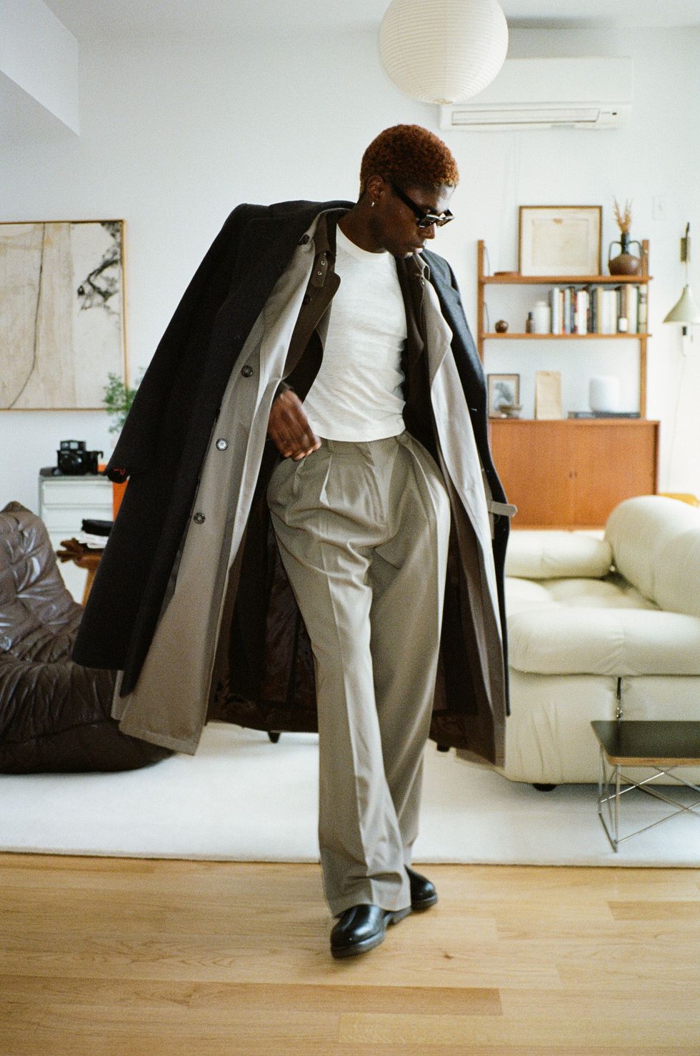 Deon Hinton in Layers of Trench Coats