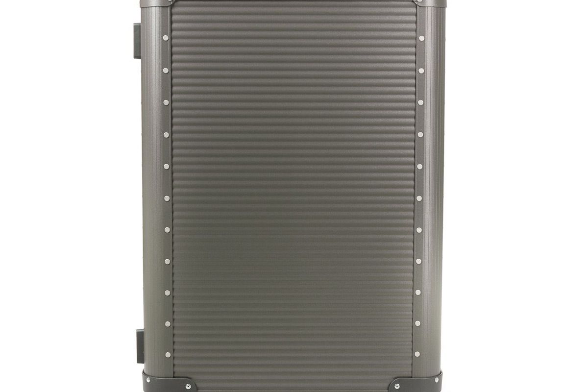 fpm fabbrica pelletterie milano stud detail luggage bag