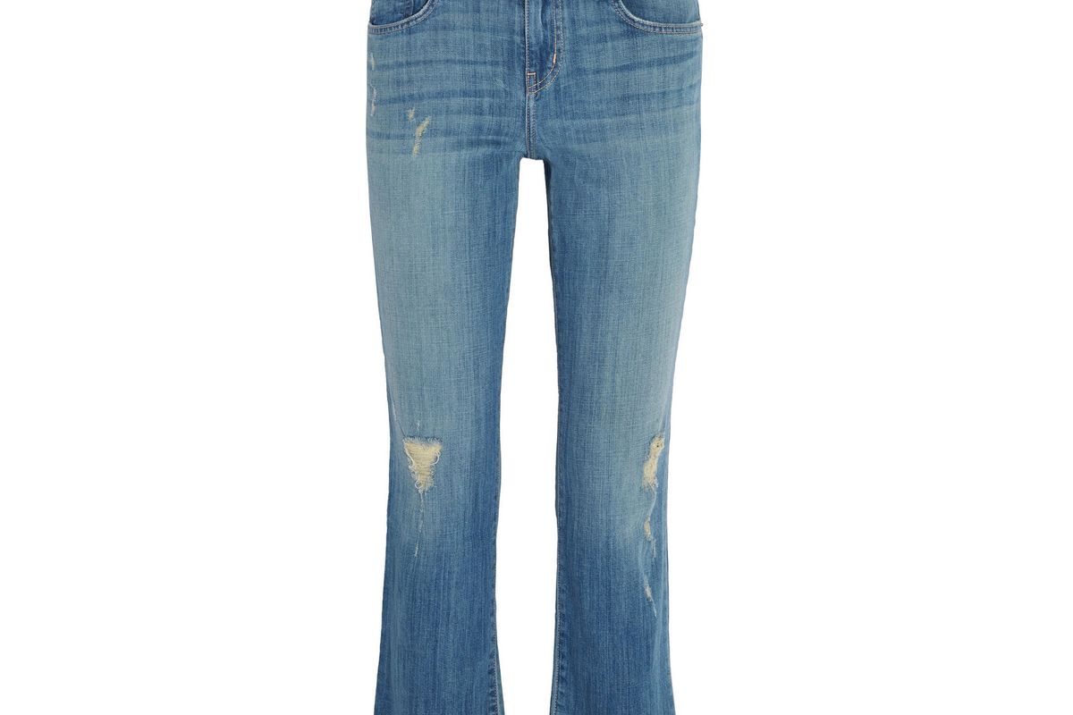 The Kick cropped distressed flared jeans
