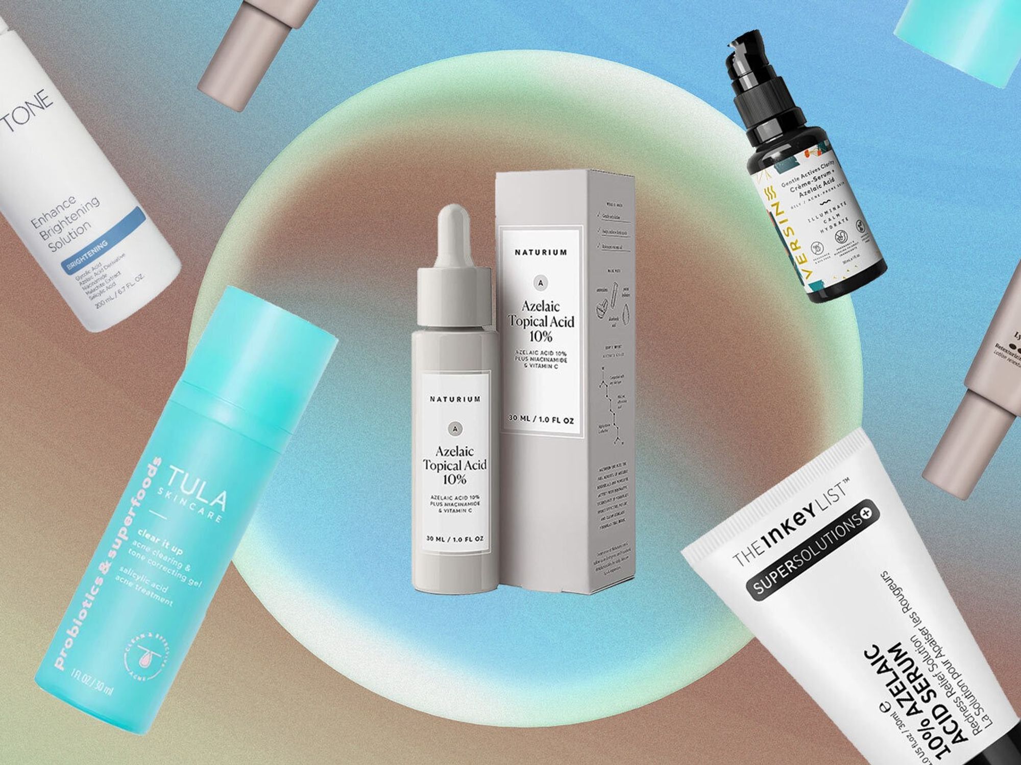 Flat lay of various azelaic acid skincare products, including Naturium and The Inkey List, on a light blue background