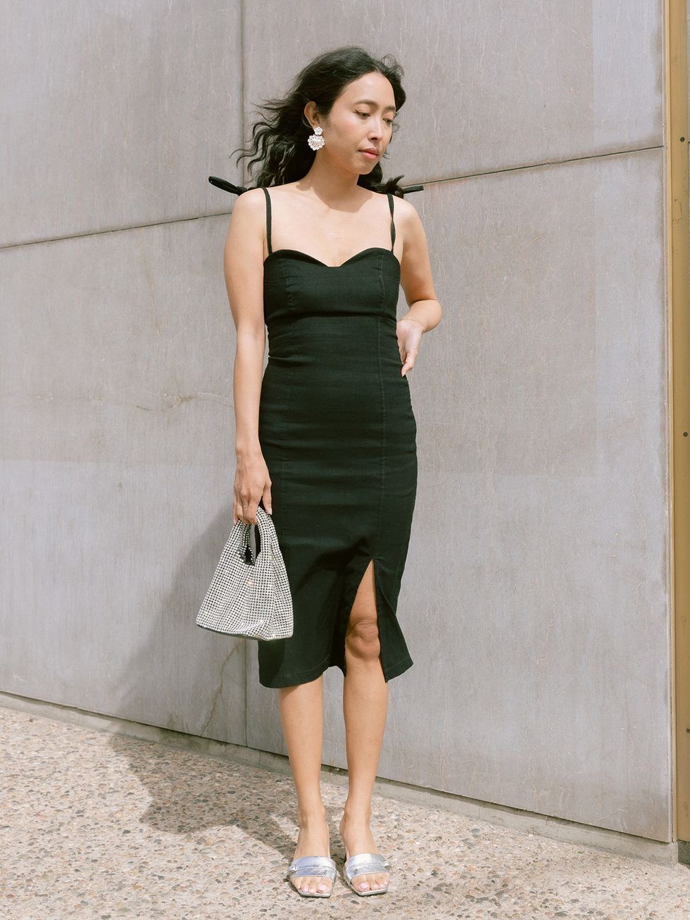 model in midi black dress