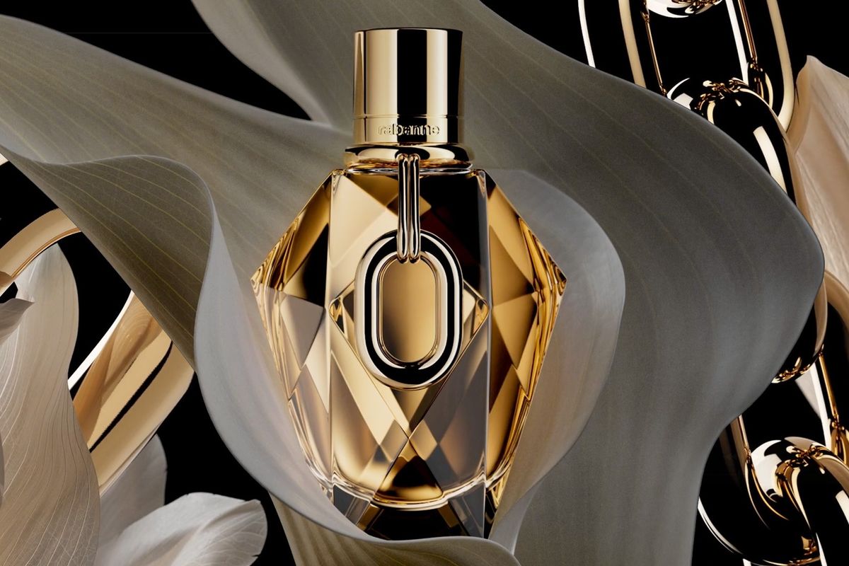 Rabanne Million Gold for Her fragrance bottle with a flowery background.