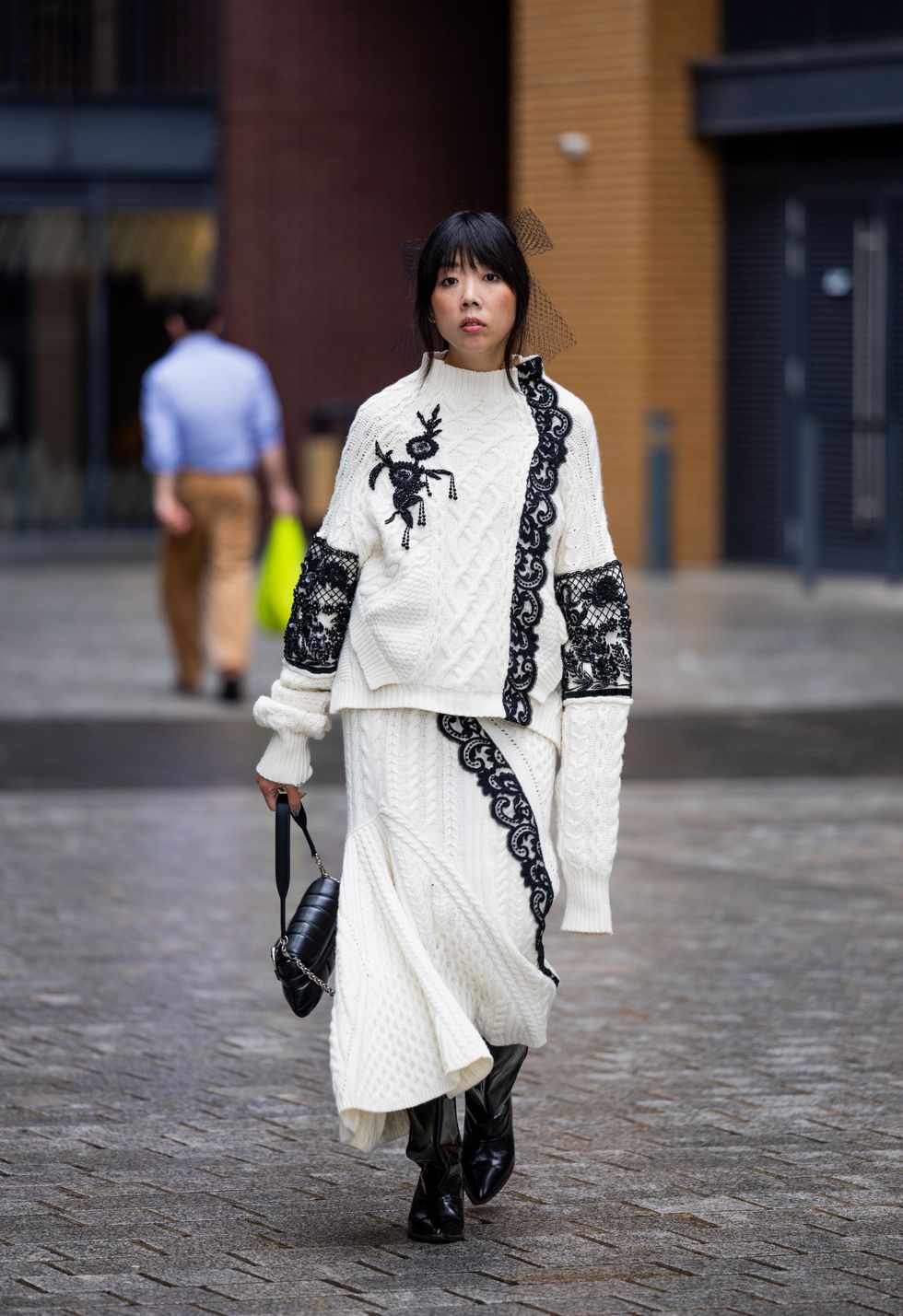 Susie Lau is seen wearing white knit, skirt outside Simone Rocha during London Fashion Week September 2023