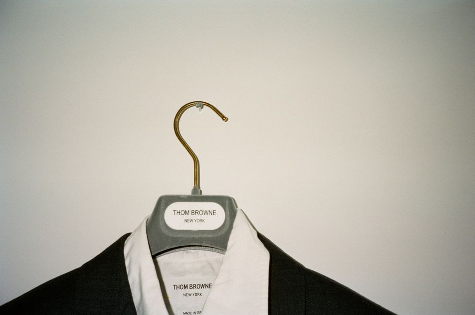 Thom Browne Blazer on a Hanger in Deon Hinton's Apartment