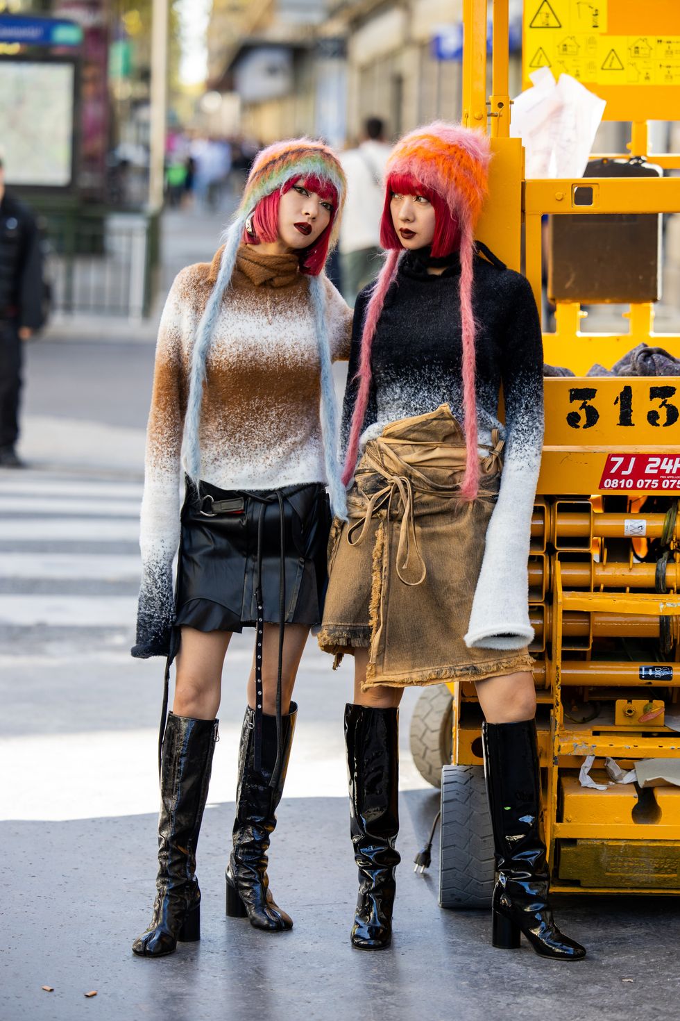 Twins Ami & Aya Amiaya wears knit hat outside Ottolinger during the Womenswear Spring/Summer 2024 as part of Paris Fashion Week